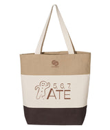 A color block multi-colored tote bag with shades of brown, an illustration of a gingerbread man, and the text "5, 6, 7, ATE"