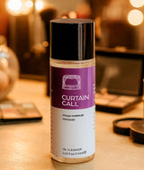 Curtain Call Stage Makeup Remover bottle on a backstage dressing room table