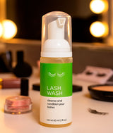 Covet Dance Lash Wash sitting on a dressing room table backstage at a dance competition