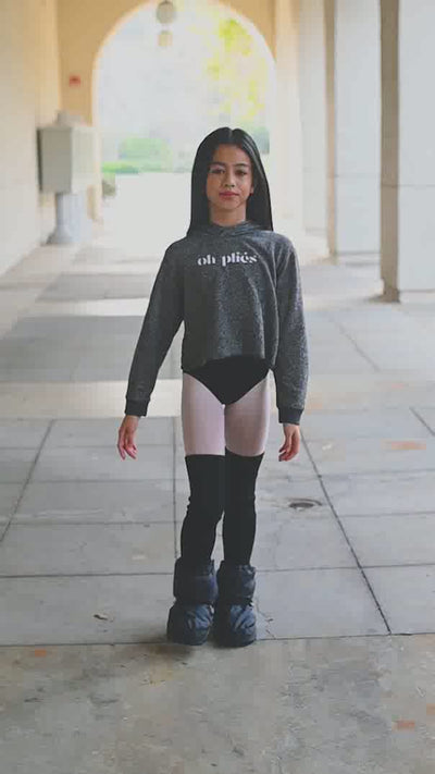 Cute young ballerina showing off her fun Oh Pliés cropped hoodie