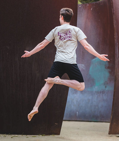 Male dancer at UCLA Sculpture Garden wearing Covet Dance tee