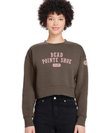 Woman wearing a brown cropped sweatshirt with pink 'Dead Pointe Shoe Club' text on a white background