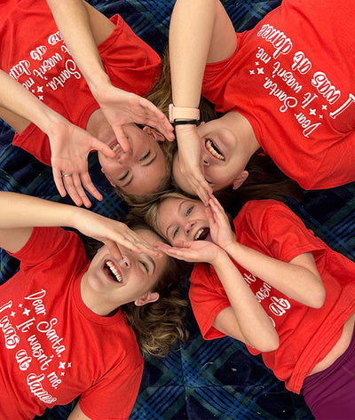 Dance friends dressed in same Dear Santa tee from Covet Dance