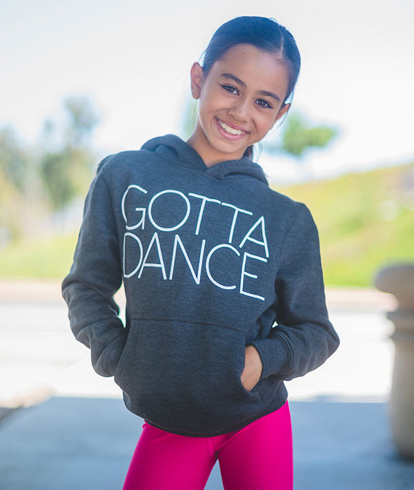 Young dancer wearing Gotta Dance charcoal-colored hoodie