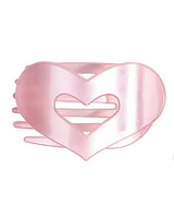 Large Pink heart-shaped hair clip on a white background