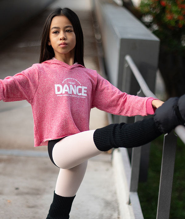 Young dancer in pink crop hoodie with puffy print