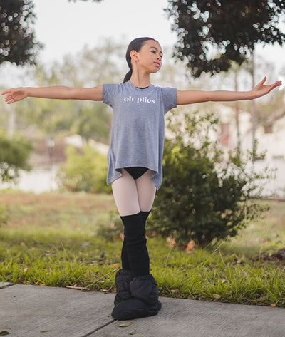 young dancer wearing Oh Pliés tee in the park
