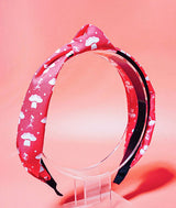 Bright Pink headband with white tutu and pointe shoe pattern on a pink background