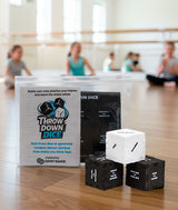 Throw Down Dice game in dance studio with dancers in the background