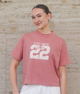 Dancer wearing a Tutu Crew t-shirt from Covet Dance against a wall outside Lincoln Center