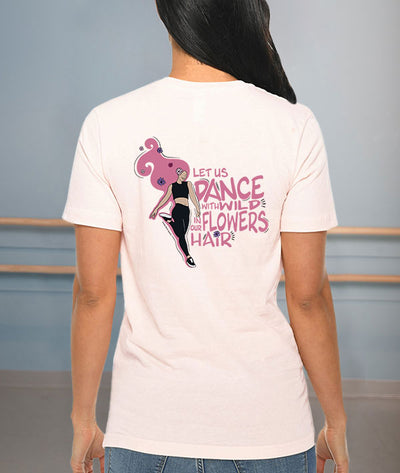 "let us dance with wildflowers in our hair" quote on pale pink tee