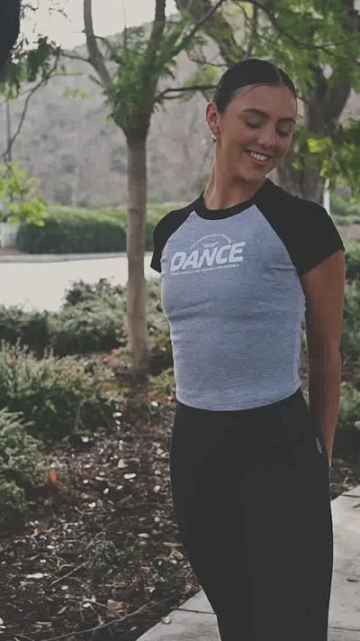LA Rams Cheerleader, Kira, showing off her moves in a Covet Dance crop raglan tee