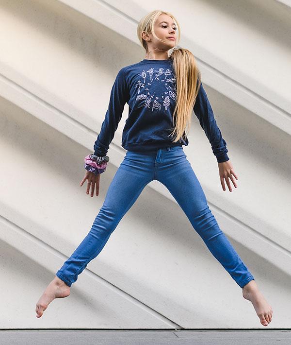 Kennedy Paige modeling an X-Small Zodiac Dancers Long Sleeve Tee