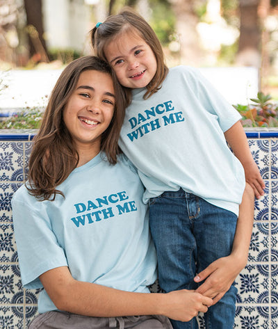 Dancing sisters wearing matching Dance With Me tees