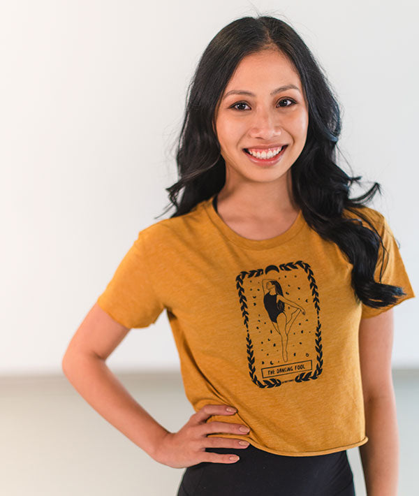 Antique Gold cropped t-shirt with The Dancing Fool tarot card imprint