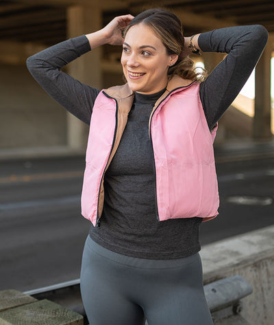 Pink side of reversible puffy crop vest