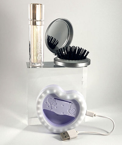 Iridescent lip gloss, compact mirror/brush, and mini ring light with charger